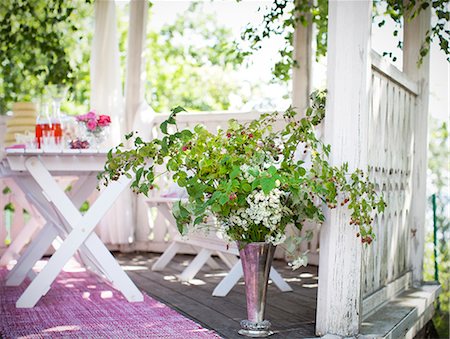 porch not people - Twigs in vase in pavilion Stock Photo - Premium Royalty-Free, Code: 6102-07158016