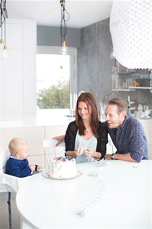 picture of person eating cake - Parents celebrating with son his first birthday Stock Photo - Premium Royalty-Free, Code: 6102-07158108