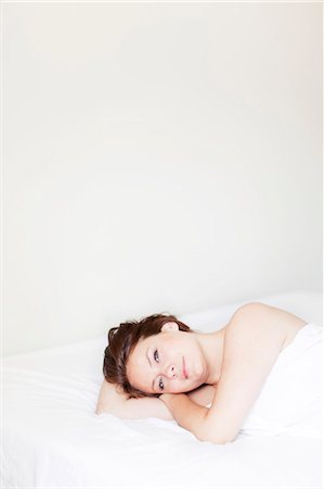 simsearch:6102-07843299,k - Young woman in bed Stock Photo - Premium Royalty-Free, Code: 6102-07158277