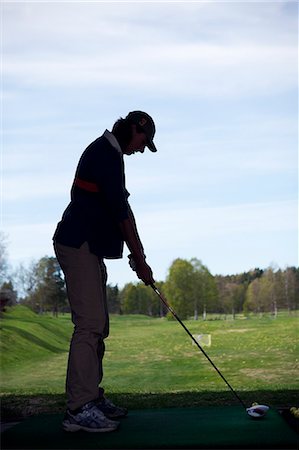 simsearch:6102-05955851,k - Silhouette of man playing golf Stockbilder - Premium RF Lizenzfrei, Bildnummer: 6102-07158378