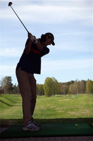 simsearch:6102-05955851,k - Silhouette of man playing golf Stockbilder - Premium RF Lizenzfrei, Bildnummer: 6102-07158379