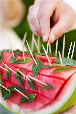 partying close up outdoor - Man eating watermelon at garden party, close-up Stock Photo - Premium Royalty-Free, Code: 6102-07282629