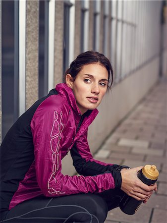 runners resting - Young runner with water bottle Stock Photo - Premium Royalty-Free, Code: 6102-07455754