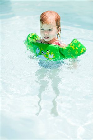 Girl swimming in swimming pool Fotografie stock - Premium Royalty-Free, Codice: 6102-07455795
