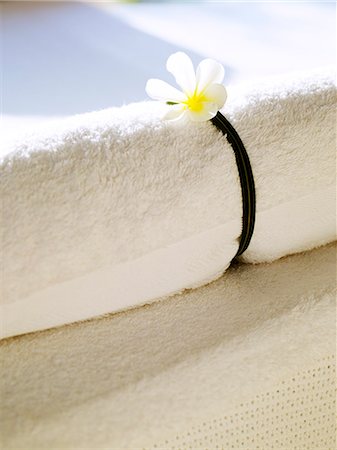 spa decoration - Towel with flower, close-up Stock Photo - Premium Royalty-Free, Code: 6102-07455727