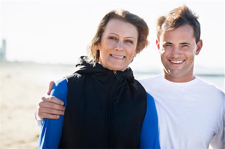 Mature woman with son on beach Stock Photo - Premium Royalty-Free, Code: 6102-07521591