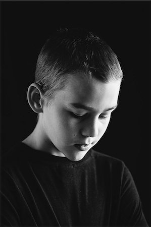 photography black and white - Portrait of boy, studio shot Stock Photo - Premium Royalty-Free, Code: 6102-07602480
