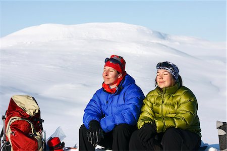 sunbath on snow - Skierns sitting and sunning Stock Photo - Premium Royalty-Free, Code: 6102-07602501
