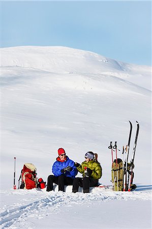 ski goggles mature not senior - Skiers have coffee in mountain scenery Stock Photo - Premium Royalty-Free, Code: 6102-07602504