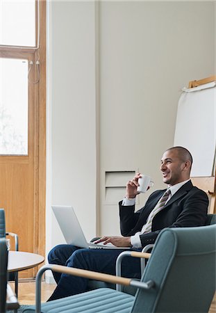 Businessman working on laptop, Stockholm, Sweden Stock Photo - Premium Royalty-Free, Code: 6102-07602618