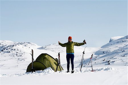 simsearch:6102-08063071,k - Woman near tent in winter mountains, Riksgransen, Lapland, Sweden Foto de stock - Sin royalties Premium, Código: 6102-07602766