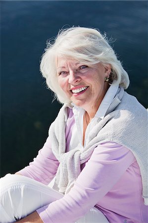 simsearch:6102-07602696,k - Smiling senior woman sitting on jetty, Bohuslan, Sweden Foto de stock - Sin royalties Premium, Código: 6102-07602714