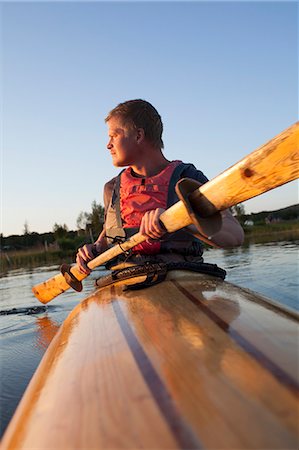 paddling - Young man kayaking, Sweden Stock Photo - Premium Royalty-Free, Code: 6102-07602872