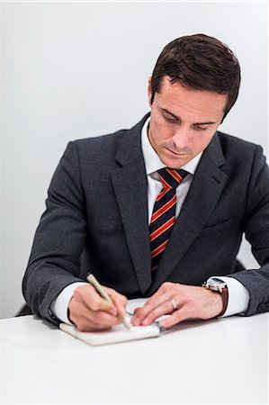 simsearch:6102-07602957,k - Mid adult businessman in office, Stockholm, Sweden Stock Photo - Premium Royalty-Free, Code: 6102-07602961