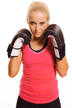 simsearch:6102-07768425,k - Young woman boxing, studio shot Photographie de stock - Premium Libres de Droits, Code: 6102-07768385