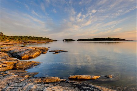 simsearch:6102-07158163,k - Rocky coast at dusk, Djuro National Park, Sweden Fotografie stock - Premium Royalty-Free, Codice: 6102-07768330