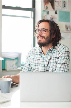 Mid adult man working in office, New Jersey, USA Stock Photo - Premium Royalty-Free, Code: 6102-07768488