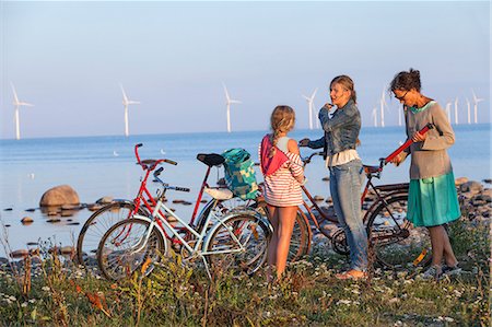 parent and teen bikes - Mother with daughters cycling, Oland, Sweden Stock Photo - Premium Royalty-Free, Code: 6102-07768433