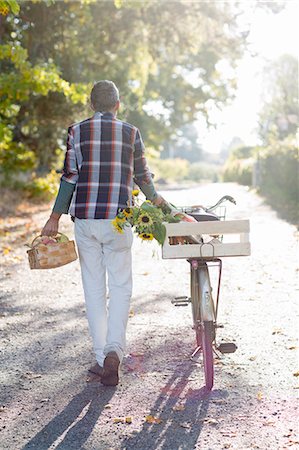 Man with bicycle, Stockholm, Sweden Stock Photo - Premium Royalty-Free, Code: 6102-07768577