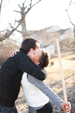 simsearch:6102-07769055,k - Couple hug in garden, Stockholm, Sweden Stock Photo - Premium Royalty-Free, Code: 6102-07768518