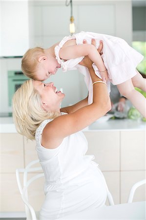 simsearch:6102-07768643,k - Pregnant woman playing with daughter, Stockholm, Sweden Stock Photo - Premium Royalty-Free, Code: 6102-07768666