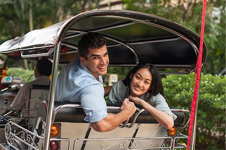 Smiling friends in rickshaw, Thailand Stock Photo - Premium Royalty-Free, Code: 6102-07768886