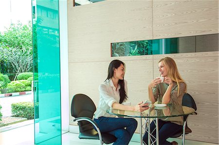 education communications - Young women having coffee, Bangkok, Thailand Stock Photo - Premium Royalty-Free, Code: 6102-07768940