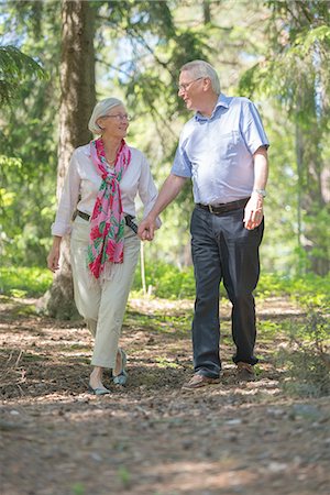 simsearch:6102-08184209,k - Senior couple walking in forest Stock Photo - Premium Royalty-Free, Code: 6102-07769276