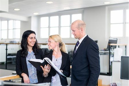 simsearch:6102-07769345,k - Business people in office Stock Photo - Premium Royalty-Free, Code: 6102-07769312