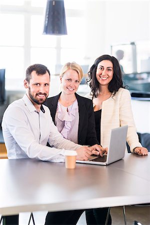 simsearch:6102-07769345,k - Business people in office Stock Photo - Premium Royalty-Free, Code: 6102-07769325