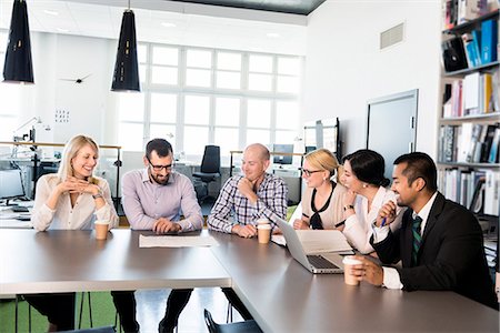 simsearch:6102-07602614,k - Business people at meeting Stock Photo - Premium Royalty-Free, Code: 6102-07769337