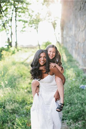 piggyback - Smiling mother with daughter Stock Photo - Premium Royalty-Free, Code: 6102-07769423