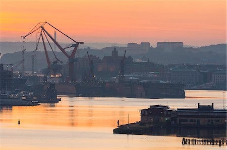 simsearch:6102-08001311,k - Shipping docks at sunset Stock Photo - Premium Royalty-Free, Code: 6102-07789541