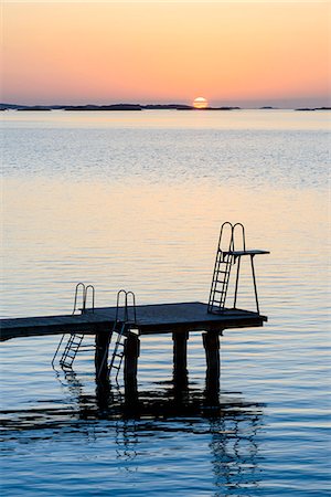 simsearch:6102-06471059,k - Jetty at sunset, Gothenburg, Sweden Foto de stock - Sin royalties Premium, Código: 6102-07789525