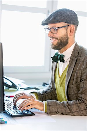 elegant computer - Mid adult man working in office Stock Photo - Premium Royalty-Free, Code: 6102-07789678