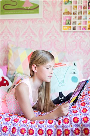 simsearch:6102-07843299,k - Girl reading in her room Stock Photo - Premium Royalty-Free, Code: 6102-07789600