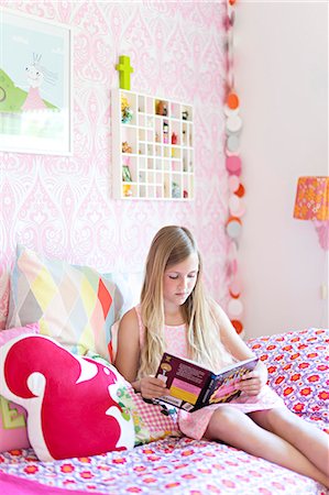 pre teen girls bed - Girl reading in her room Stock Photo - Premium Royalty-Free, Code: 6102-07789605