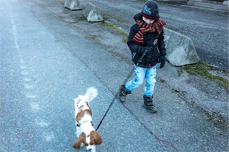 Girl walking with dog Stock Photo - Premium Royalty-Free, Code: 6102-07790005