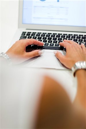 Woman using laptop, close-up Stock Photo - Premium Royalty-Free, Code: 6102-07842669