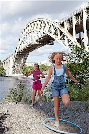 simsearch:6102-07843140,k - Two girls with hula hoops Photographie de stock - Premium Libres de Droits, Code: 6102-07842981