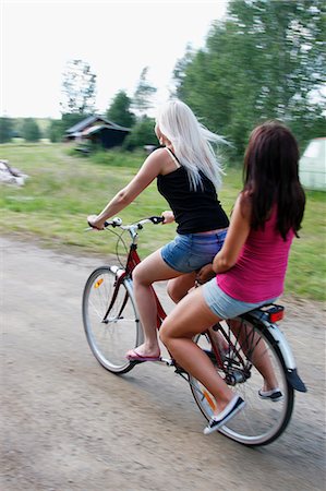 Young women cycling Stock Photo - Premium Royalty-Free, Code: 6102-07843140