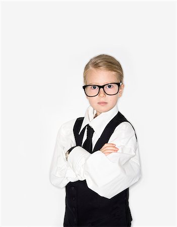 Girl dressed as businesswoman, studio shot Stock Photo - Premium Royalty-Free, Code: 6102-07843156