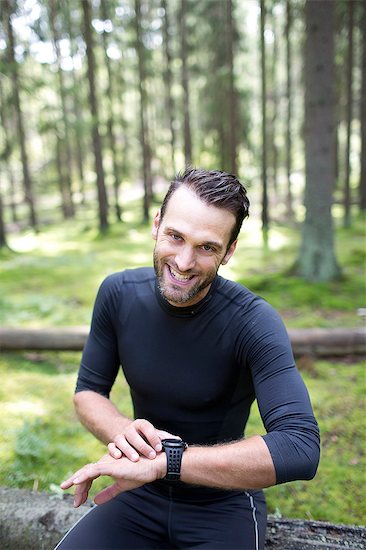 Mid adult man in forest Stock Photo - Premium Royalty-Free, Image code: 6102-07843104