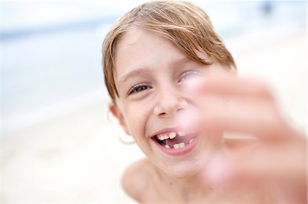 Smiling boy on beach Stock Photo - Premium Royalty-Free, Code: 6102-07843309