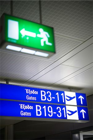 simsearch:6102-07843505,k - Gate signboard at airport, close-up Stock Photo - Premium Royalty-Free, Code: 6102-07843493