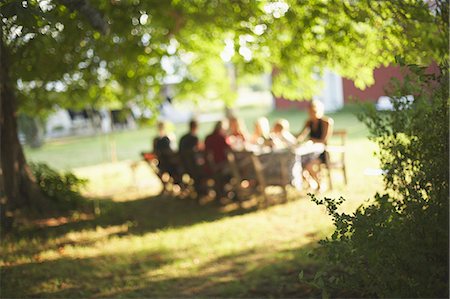 summer family meals - Family having meal in garden Stock Photo - Premium Royalty-Free, Code: 6102-07843644