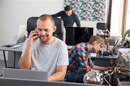 simsearch:6102-07843687,k - Young men in office Stock Photo - Premium Royalty-Free, Code: 6102-07843655
