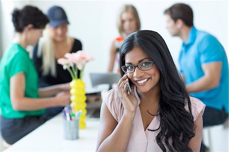 simsearch:6102-08566676,k - Smiling woman talking via cell phone Stock Photo - Premium Royalty-Free, Code: 6102-07843687