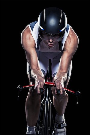 simsearch:632-05991710,k - Mid adult woman cycling, studio shot Stock Photo - Premium Royalty-Free, Code: 6102-07843627