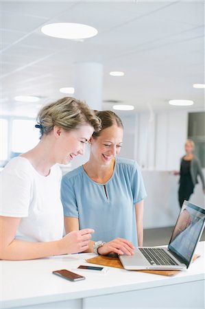 simsearch:6102-07602947,k - Women working in office Stock Photo - Premium Royalty-Free, Code: 6102-07843705